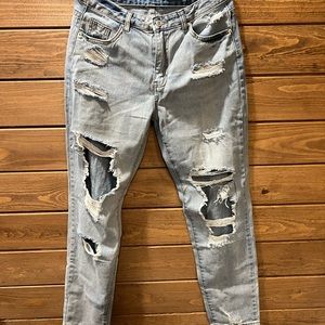 NWT jeans with holes on front side. Size medium 8/10 Brand new never worn